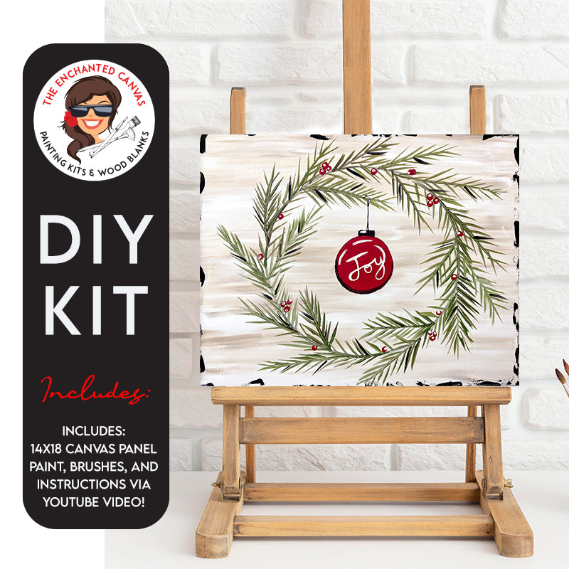 Ornament in Wreath DIY Painting Kit. Featuring a brush stroke creame and white background. Green holly berry wreath that surrounds a red ornament hanging from it. Joy is in the middle of the ornament.