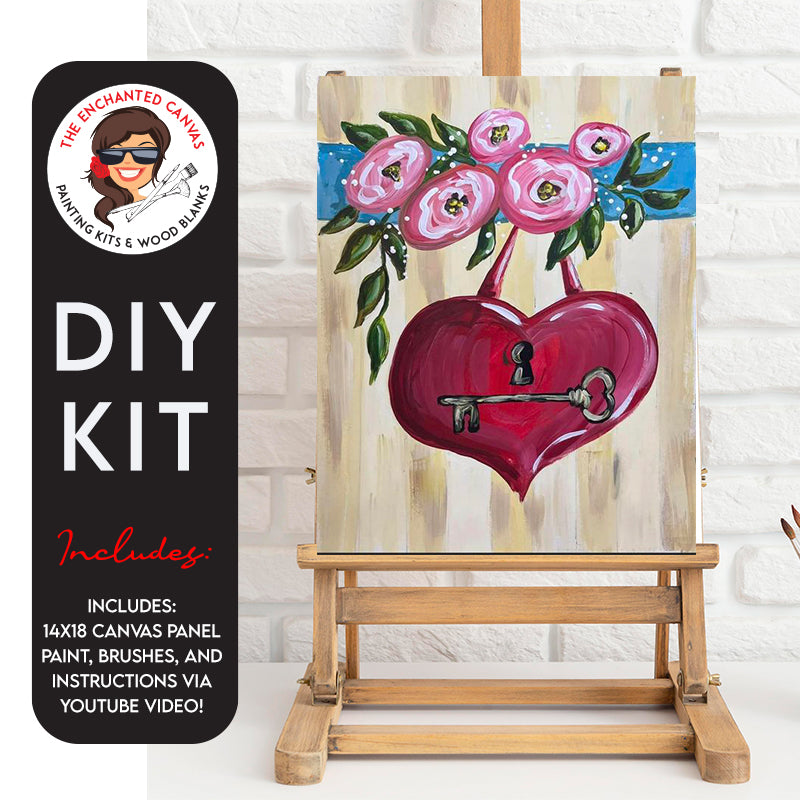 Key to My Heart DIY Painting Kit. Features a large red heart with keyhole in center and key. Heart is hanging from a horizontal blue band that is adorned with pink flowers and greenery.