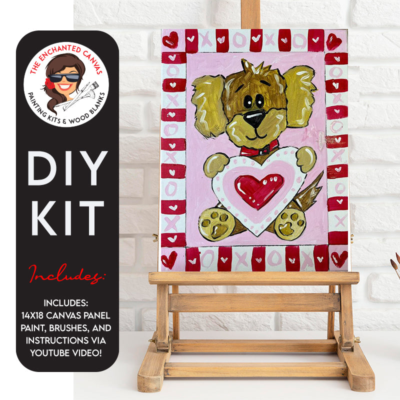 Adorable little brown puppy sitting upright holding a pink, red and white heart in his paws. Pnk background with a frame around it. Frame is blocks of hearts with differnt pink and white background to them.